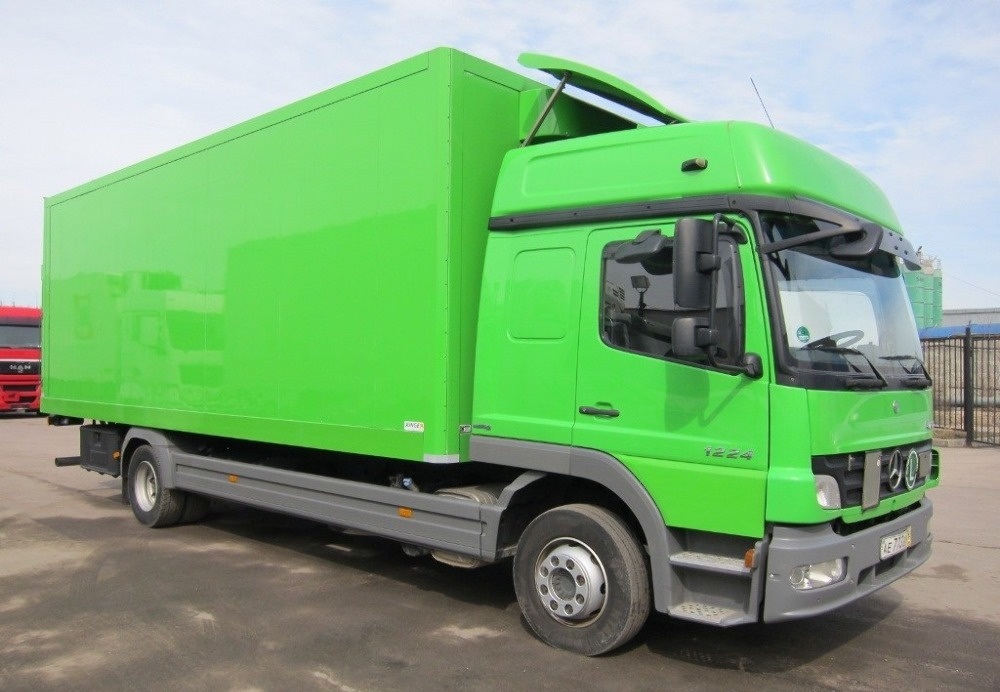 Грузоперевозки Ханты-Мансийск 10 тонн машина зеленого цвета